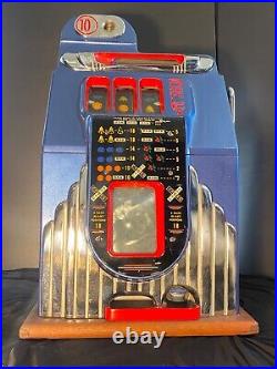 10 cent Rare This is a 1930s Buckley slot machine. In good condition