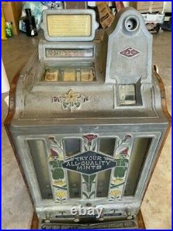 1920's 5 cent Jennings Dutch Boy Slot Machine. Original condition and working