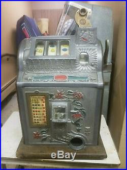 1929 Mills New Jackpot Bell Poinsettia 5 Cent Slot Machine