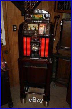 1955 Jennings Buckaroo Nickel Slot Machine with stand