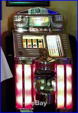 1955 Jennings Buckaroo Nickel Slot Machine with stand