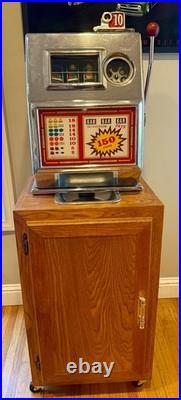 1960's Pace slot machine and cabinet it works