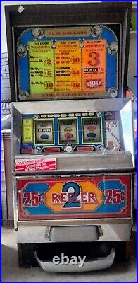 25 Cent Reeler Antique Slot Machine
