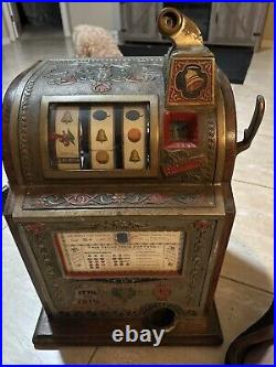 A Mills Novelty Co. Liberty Bell Five Cent Slot Machine