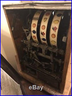 Antique 1930's MILLS 5 cent dime castle front slot machine. Working
