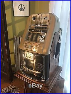 Antique Mills Slot Machine 25 cent, silver quarters inside! Includes shipping
