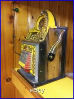 Antique rol-a-top nickel slot machine