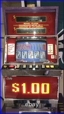 Ballys Vintage Video Poker Machine. Takes Dollar Tokens. Stand/base is included