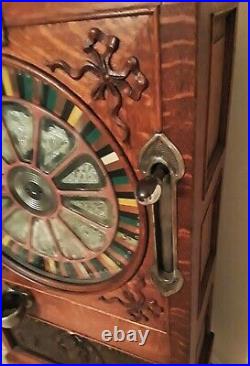 Circa 1898 Calle Bros. PUCK Upright Slot Machine Stunning