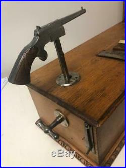Early table model FRENCH gun shooting game with token pay-out for a winner