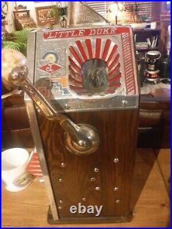 Jennings 1932 1 cent Little Duke slot machine. Perfect cond. Pro. Restored