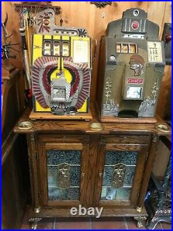 Jennings Chief Slot Machine & Mills War Eagle Slot machines & Ornate oak stand