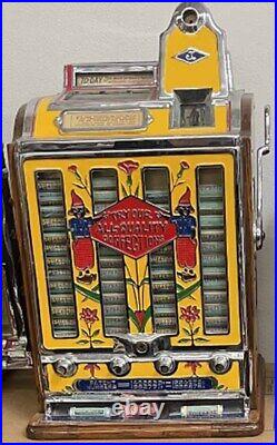 Jennings Penny Slot Machine with four front mint roll dispenser Circa 1930's