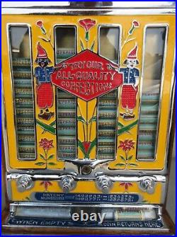 Jennings Penny Slot Machine with four front mint roll dispenser Circa 1930's