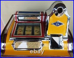 Jennings Penny Slot Machine with four front mint roll dispenser Circa 1930's
