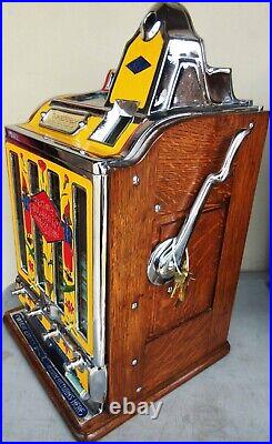 Jennings Penny Slot Machine with four front mint roll dispenser Circa 1930's