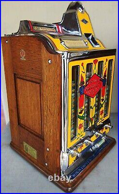 Jennings Penny Slot Machine with four front mint roll dispenser Circa 1930's