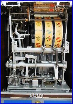 Jennings Penny Slot Machine with four front mint roll dispenser Circa 1930's