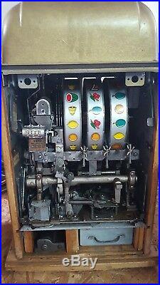 Mills 5-cent 777 hi-top antique slot machine plus stand