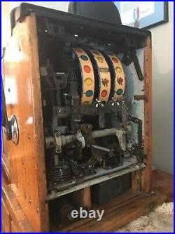 Mills 5-cent slot machine collectible excellent condition
