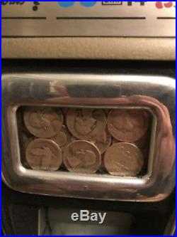 Mills 777, quarter Slot Machine, With Money Box. Including Stand