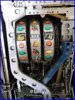 Mills Joker Wild Antique Slot Machine with Stand