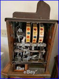 Mills Novelty Company 1-Cent Brown Front Slot Machine and Ornate Stand