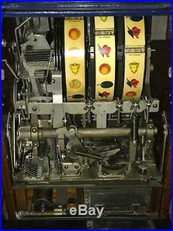 Mills Novelty Company Roman Head 5-Cent Slot Machine, Side Vendor withGold Award