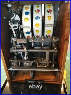 Mills/Pace 1920s 5¢ Jackpot Poinsettia slot machine