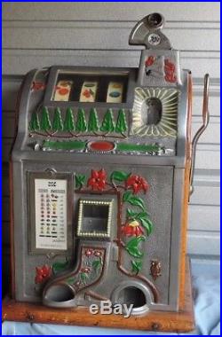Mills Poinsetta. 25 cent slot machine