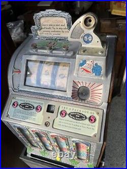Mills five cent slot machine with mid vendor front