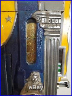 MillsNovelty Co Roman Head 5-Cent Slot Machine, Side Vendor, Gold Award, stand