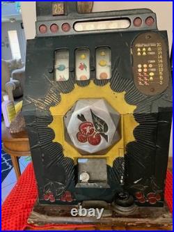 Old style, original, 25 cent cherry slot machine, good working condition