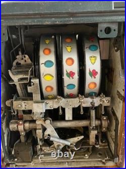 Old style, original, 25 cent cherry slot machine, good working condition