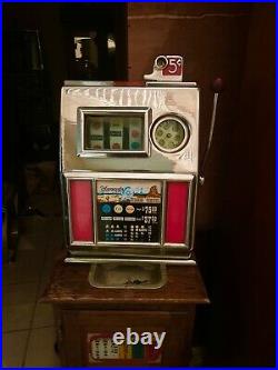 Vintage Harvey's Wagon Wheel 5 Cent Slot Machine With Stand