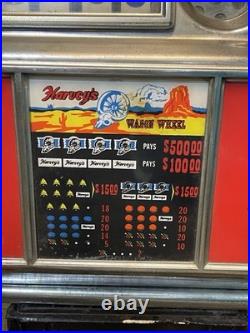 Vintage coin op slot machine, Harvey's Wagon Wheel. 10 cent. Working