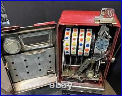 Vintage coin op slot machine, Harvey's Wagon Wheel. 10 cent. Working