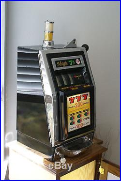 Vintage mills slot machine and oak stand