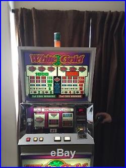 White Gold Ballys Token Slot Machine With Cabinet Stand
